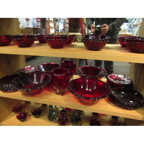 1041 - A collection of Cranberry glass including bowls, dishes, vase and candle holders with three duck fig... 