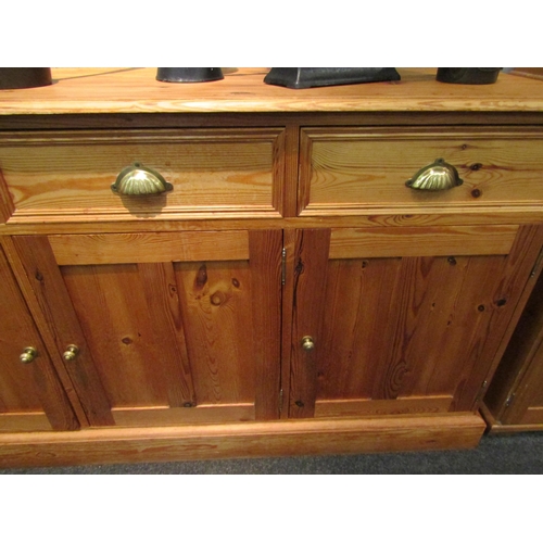 1072 - A pine dresser base with three drawers over three door cupboard, 87cm high x 152cm wide x 45cm deep ... 