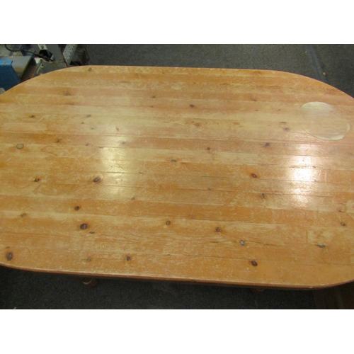 1106 - A modern pine kitchen table, rounded top, turned legs, 75cm high x 136cm long x 75cm wide   (E) £10-... 