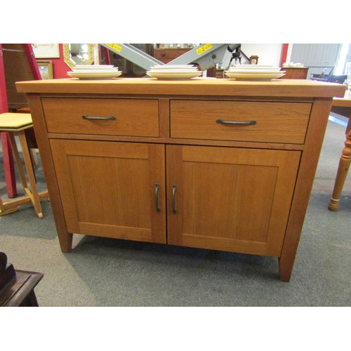 1113 - An Eastern European solid oak sideboard, twin drawers over a pair of cupboard doors, 86cm high x 120... 