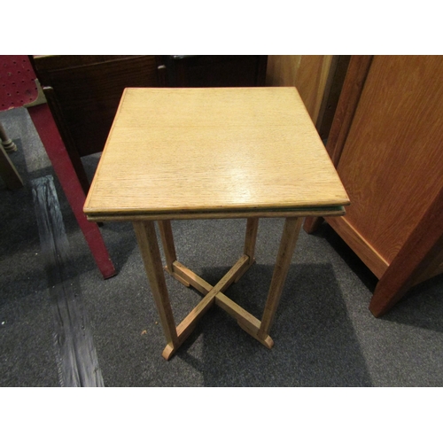 1114 - A 1940’s light oak compact card table with baize lining