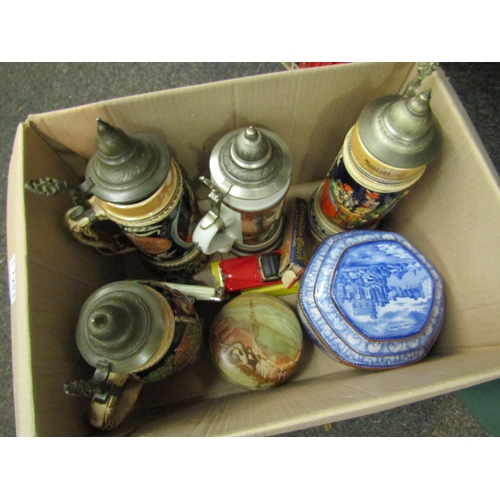 1253 - A box containing assorted including beer steins, model cars etc