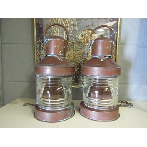 1265 - A pair of copper and glass ships lanterns, approximately 31cm high