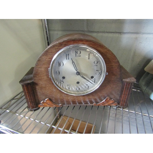 1269 - An oak cased mantle clock