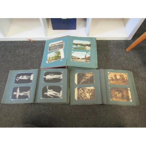 1293 - Three postcard albums, two containing Continental cards, on containing early 20th Century UK topogra... 