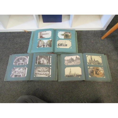 1293 - Three postcard albums, two containing Continental cards, on containing early 20th Century UK topogra... 