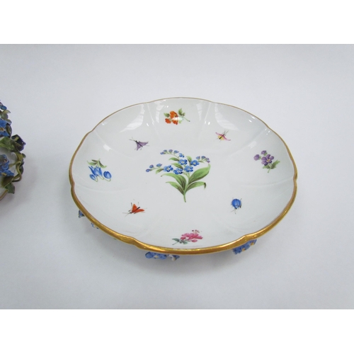 1297 - A 19th Century Meissen chocolate cup and cover decorated with high relief flowers and painted insect... 