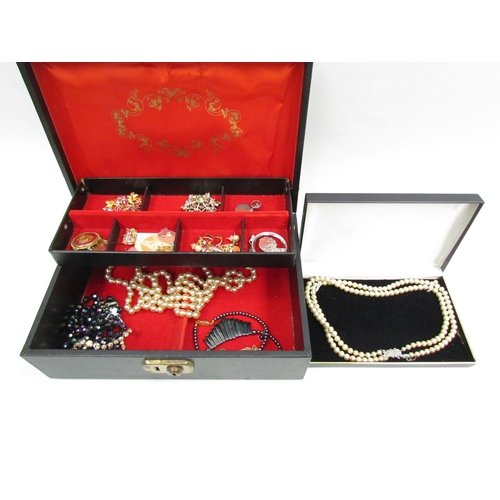 1305 - A jewellery box with bijouterie contents, necklaces, brooches and earrings