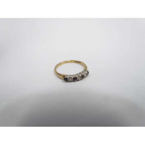 1309 - A 9ct diamond and sapphire ring