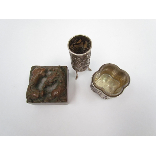 1320 - Two Chinese white metal items, a salt with exterior scenes and a miniature vase on tripod feet with ... 