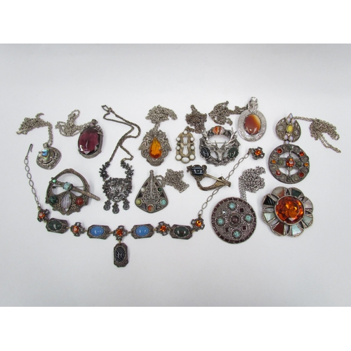 1321 - Five brooches including white metal wreath with stags head to centre and Scottish hardstone cabochon... 