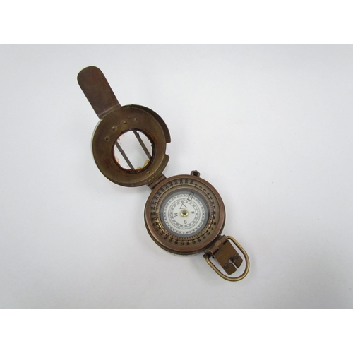 1325 - A T.G. Co. Ltd. of London military compass marked P143 to rear, crack to glass