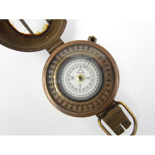 1325 - A T.G. Co. Ltd. of London military compass marked P143 to rear, crack to glass