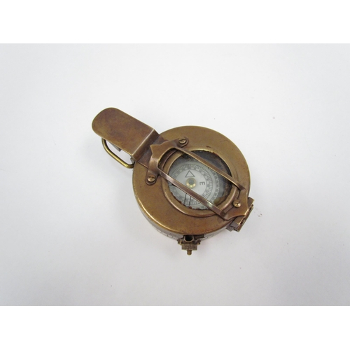 1325 - A T.G. Co. Ltd. of London military compass marked P143 to rear, crack to glass