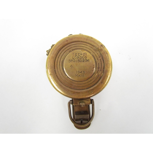 1325 - A T.G. Co. Ltd. of London military compass marked P143 to rear, crack to glass