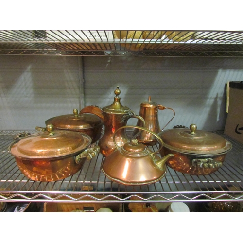 1425 - A selection of copper and brass items including three lidded pans / tureens, kettles and Arabic coff... 