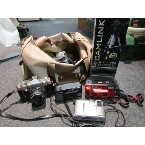 1459 - A bag containing cameras and accessories and a boxed tripod