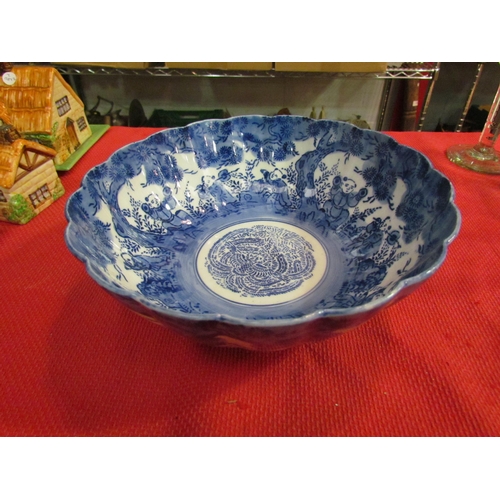 1474 - A Chinese scalloped edge blue and white bowl with figures and prunus, 25cm diameter   (E) £15-30