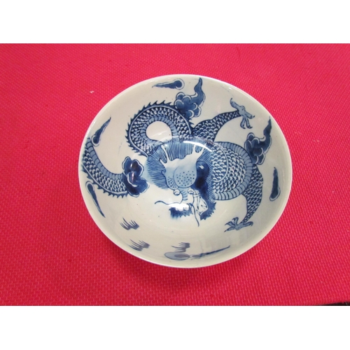 1482 - A Chinese blue and white bowl with dragon chasing the flaming pearl, character marks to base, 8cm hi... 