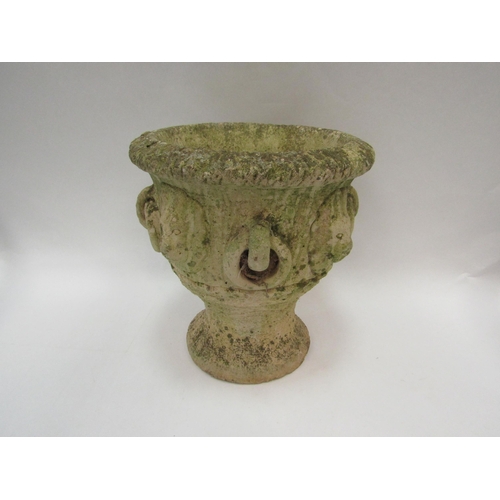 1081 - A composition garden urn with lion mask and ring loop detail to body, with Cotswold Studios Ltd. sta... 