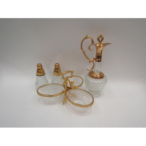 1109 - A modern gilt metal and moulded glass oil decanter together with a pair of salt and pepperettes and ... 