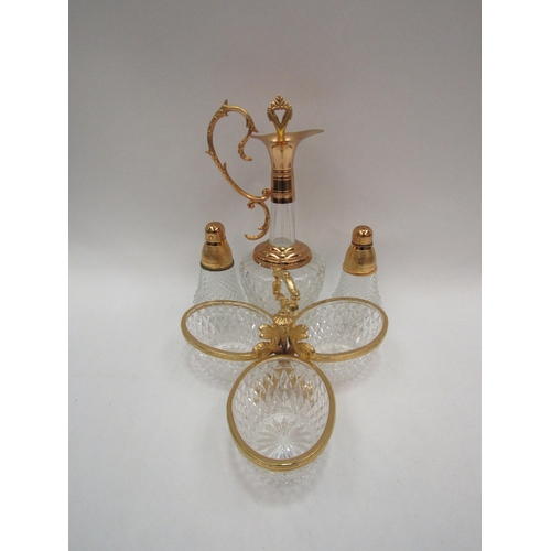 1109 - A modern gilt metal and moulded glass oil decanter together with a pair of salt and pepperettes and ... 