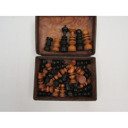 1121 - A boxwood and ebony chess set, some minor losses, the King measures 7cm tall approx., with tooled le... 