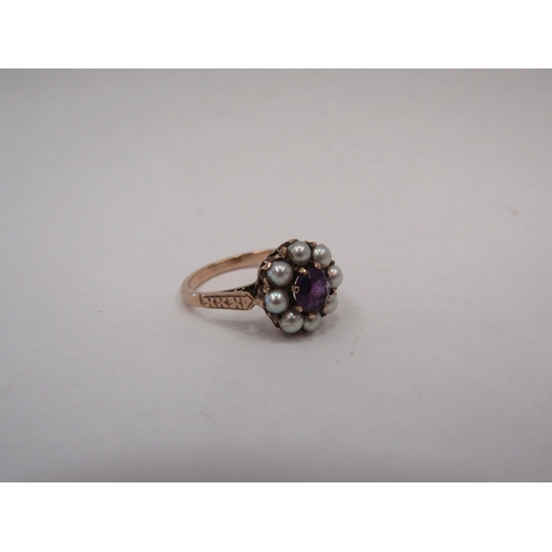 1326 - A rose gold pearl and amethyst dress ring, central amethyst surrounded by eight pearls.  Stamped 9ct... 