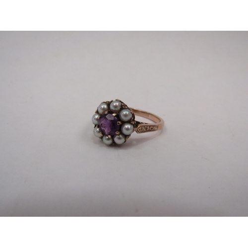 1326 - A rose gold pearl and amethyst dress ring, central amethyst surrounded by eight pearls.  Stamped 9ct... 