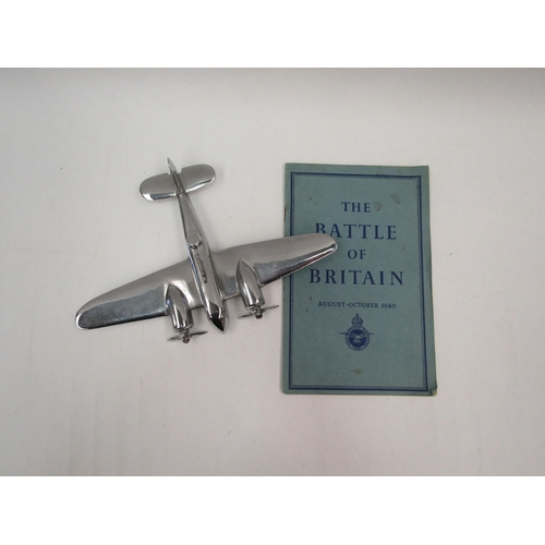 1342 - An alloy model of a WWII era bomber aircraft, 16.5 x 23.5cm, together with a Battle of Britain HMSO ... 