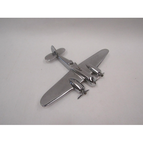 1342 - An alloy model of a WWII era bomber aircraft, 16.5 x 23.5cm, together with a Battle of Britain HMSO ... 