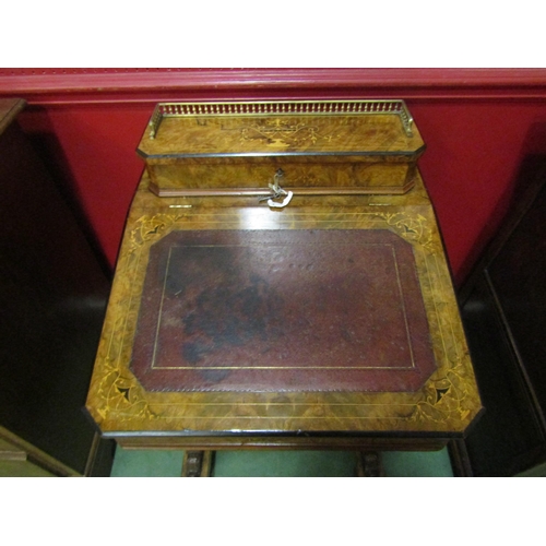 4023 - An Edwardian burr walnut four drawer Davenport with tooled leather writing surface and galleried lif... 