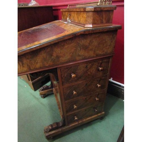 4023 - An Edwardian burr walnut four drawer Davenport with tooled leather writing surface and galleried lif... 