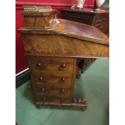 4023 - An Edwardian burr walnut four drawer Davenport with tooled leather writing surface and galleried lif... 