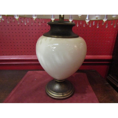 4028 - A table lamp with Grecian urn style base in brown/beige tones with jewel tasselled shade            ... 