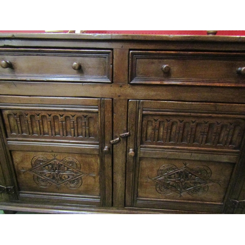 4029 - A Titchmarsh & Goodwin 17th Century revival carved and pegged oak dresser base the two frieze drawer... 