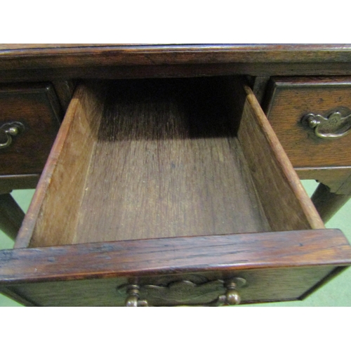 4048 - Circa 1780 a country oak lowboy, the rectangular top with pinched corners over three drawers and sha... 