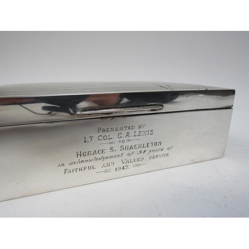 4239 - A silver cigarette box with engraved dedication 