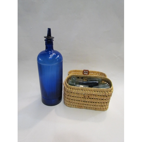 4299 - A basket of miscellaneous medicine bottles and an over size Bristol blue medicine bottle (40cm high)