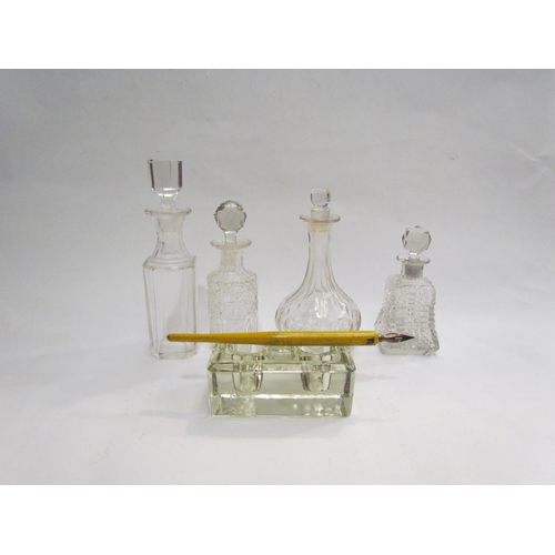 4300 - A collection of four glass condiment oil/vinegar bottles and an Art Deco glass pen stand with inkwel... 