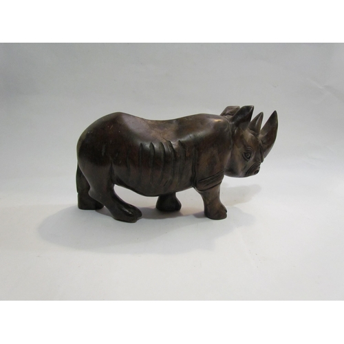 4304 - A wooden rhino, a boat shaped cruet set and an Oriental lidded pot (16cm high)