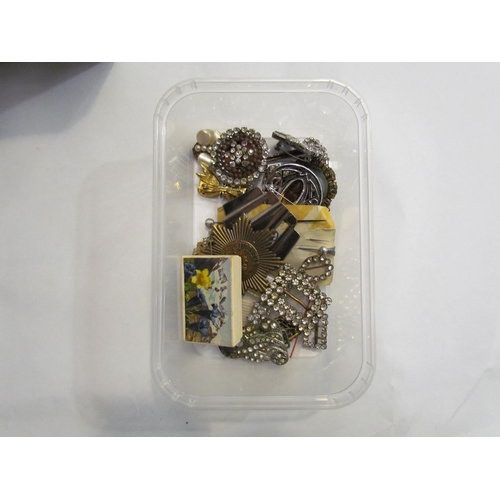 4307 - A vintage travel case with bijouterie contents to include paste set hair comb and similar hair grips... 