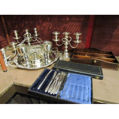 4320 - A quantity of assorted plated wares including flatware candlesticks, goblets etc