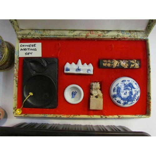 4340 - A mixed lot including carved wooen Chinese figures, cased part writing set, cloisonne vase, Japanese... 