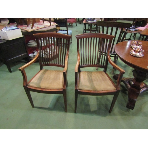 4085 - A pair of carver chairs with bar-backs, upholstered seats, wavy back legs