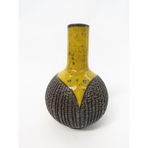 7034 - A Poole Pottery stoneware vase by Guy Sydenham in black relief and yellow glaze. Impressed and incis... 