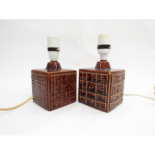 7040 - A pair of Poole Pottery 'Helios' pattern table lamp bases by Robert Jefferson, treacle glazed. 11.5c... 