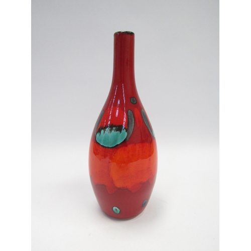 7042 - A modern Poole Pottery bottle form vase, 'Volcano' range in reds, orange and blue. 27.5 cm high