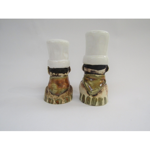 7047 - A rare Chelsea Pottery pair of salt and pepper pots in the form of chefs. Marked 'Chelsea' to one. 1... 