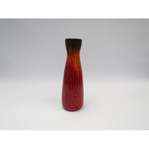 7071 - A Scheurich West German lava glazed vase in red and orange with vertical lines No. 320/28, 28cm high